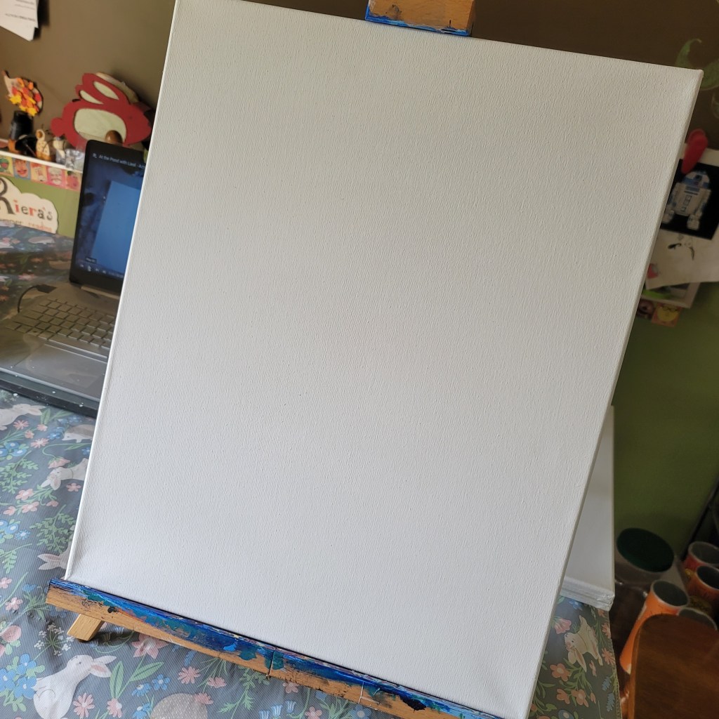 An empty canvas on an easel, set up for painting.